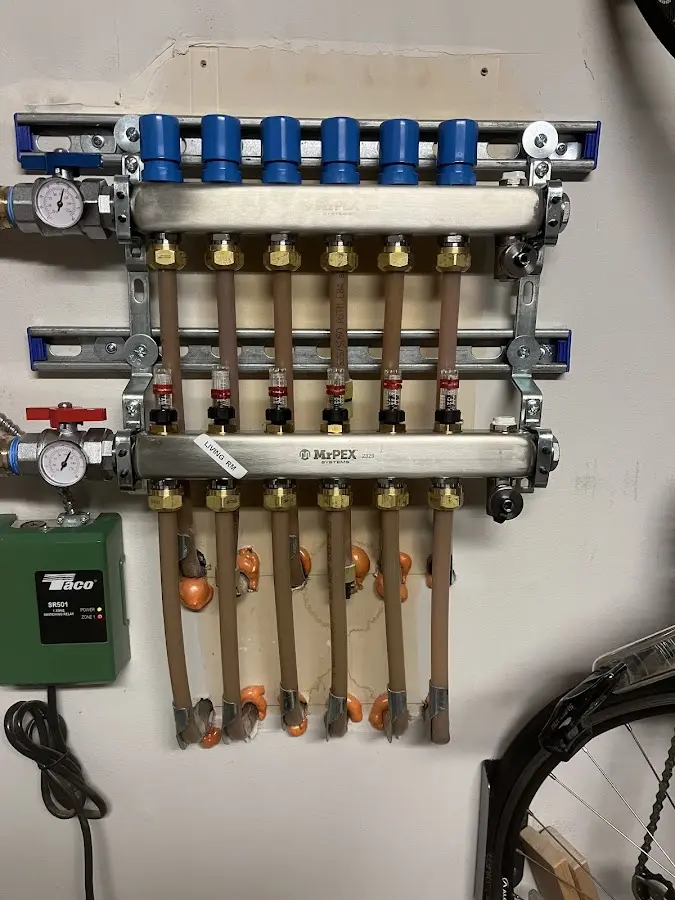 Plumber performing Water Heater Repair at a residential property in Livingston